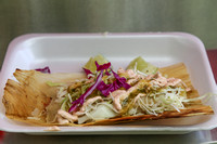 A tamale by SHAVE 'N FLAV Catering, topped with Sullivan's special "Consuela" sauce.