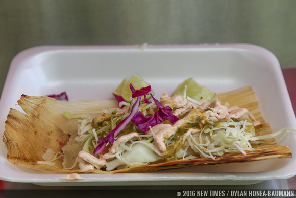 A tamale by SHAVE 'N FLAV Catering, topped with Sullivan's special "Consuela" sauce.