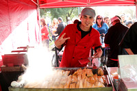 Steven Sullivan, owner of SHAVE 'N FLAV catering, preparing hot tamales on the grill .