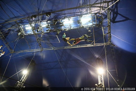 Marinelli swings upside down on the trapeze to catch Quiroga midair for a breathtaking performance.