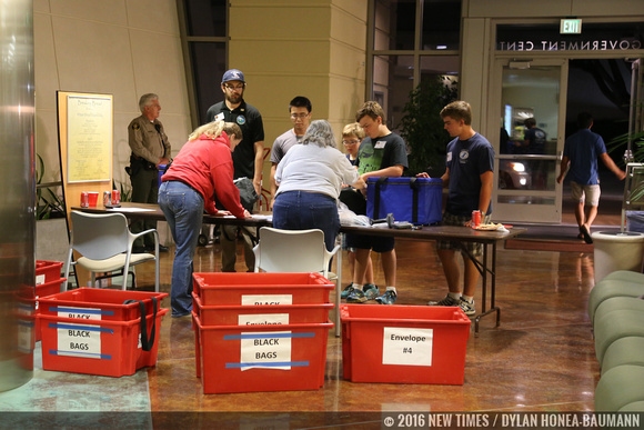 More volunteers collect votes at the county offices downtown, ready to get them tabulated.