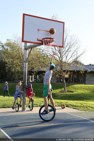 Kyle Martin, a member of the SLO Ballerz unicycle basketball team, dunks the ball at Meadow Park.