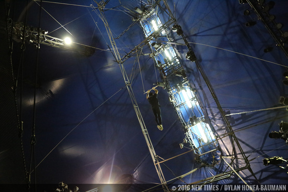 From this angle, it's clear how high up in the air the trapeze performers swing.
