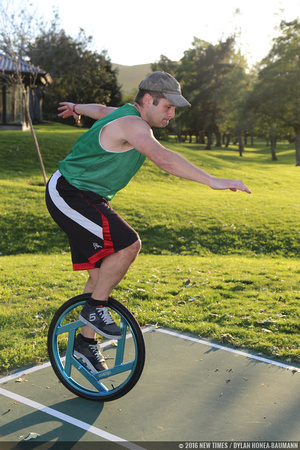 Carl Hunt, a member of the SLO Ballerz unicycle basketball team, balances on a unicycle at the park.