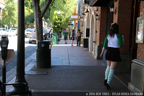 A girl in green-striped socks enters Mother's Tavern.